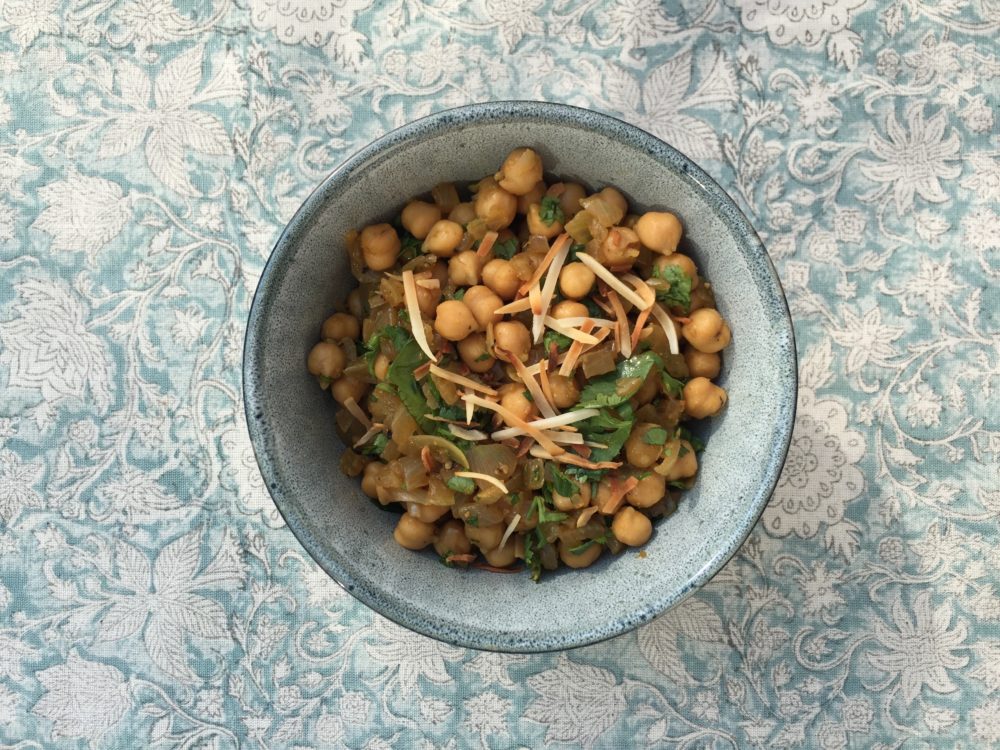 A bowl of chickpeas with garnish