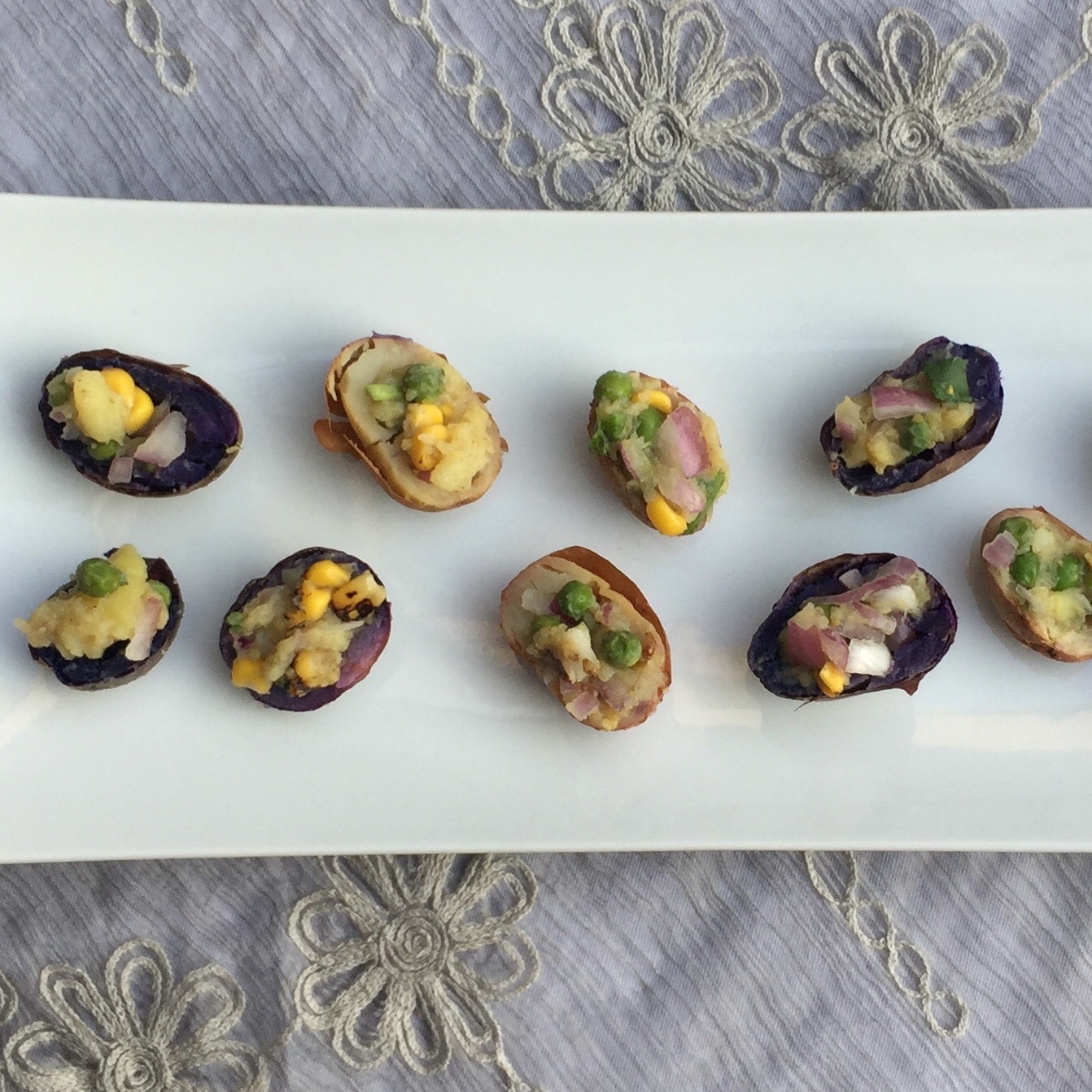 Samosa Potato Skins served on a white platter